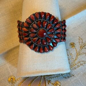Sterling silver setting with genuine red coral cabochons arranged in a rosette